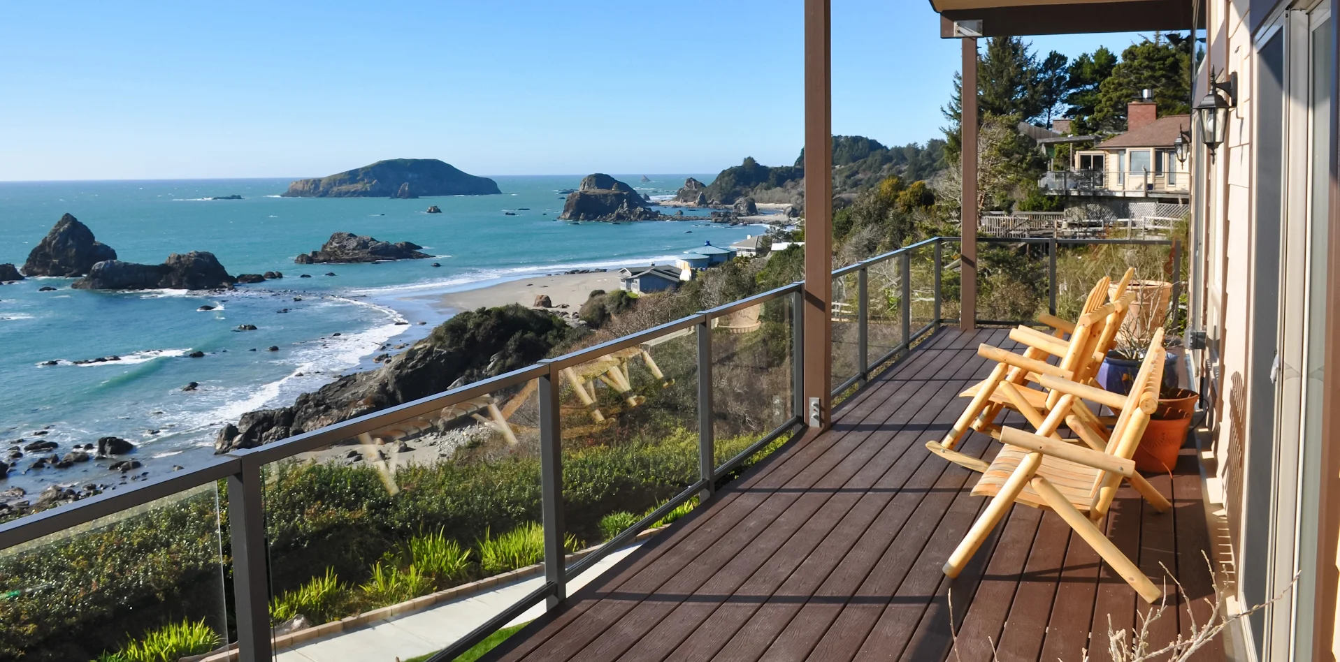 eGlass railing systems on a deck overlooking water